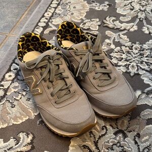 New Balance Gray Athletic Shoes with Yellow Accents